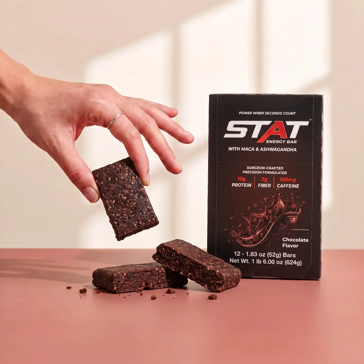 STAT Chocolate box with a bar held above it