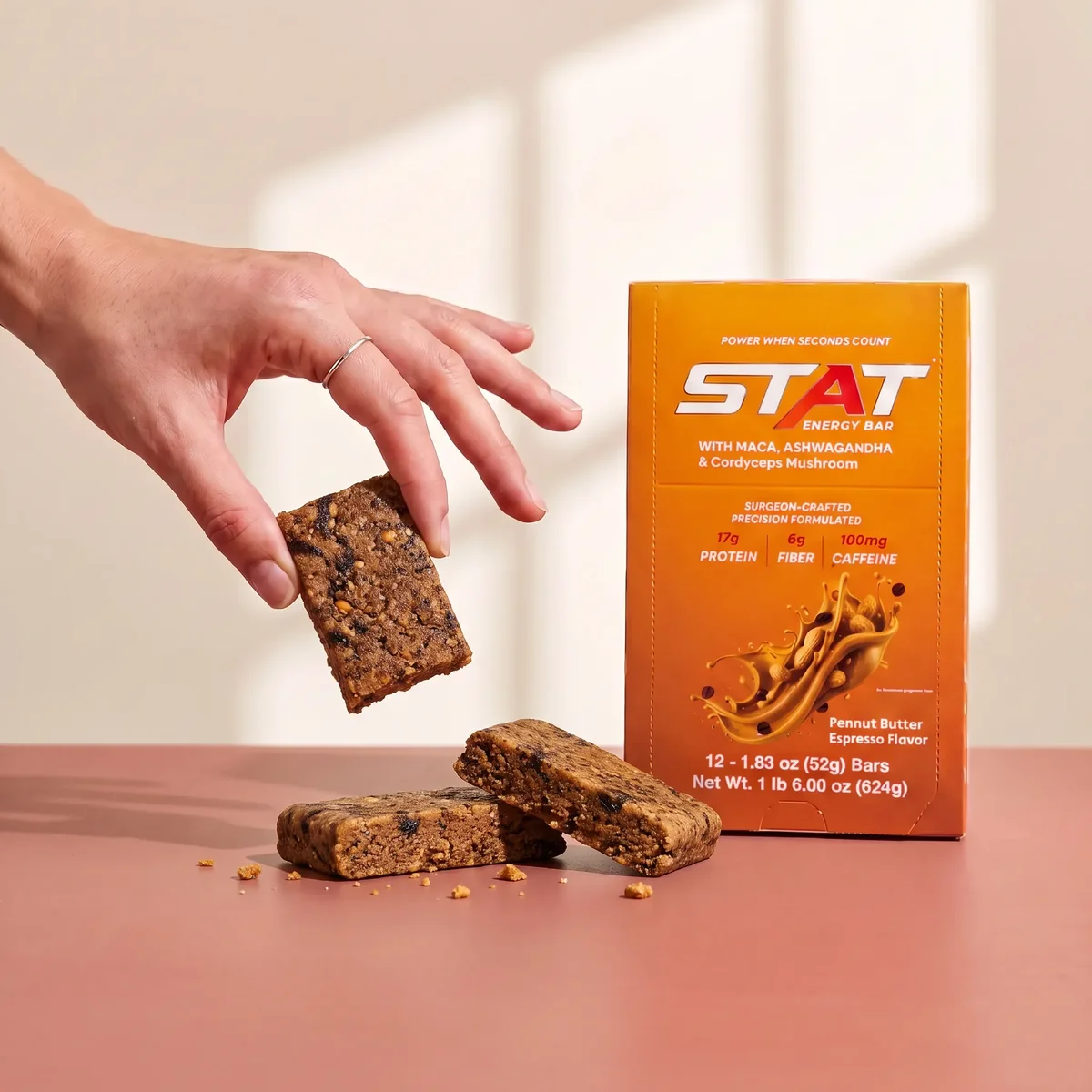 STAT Peanut Butter Espresso box with a bar held above it
